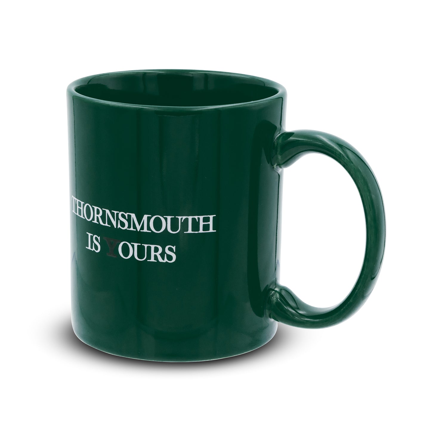 Green mug that reads thornsmouth is your's the Y is black
