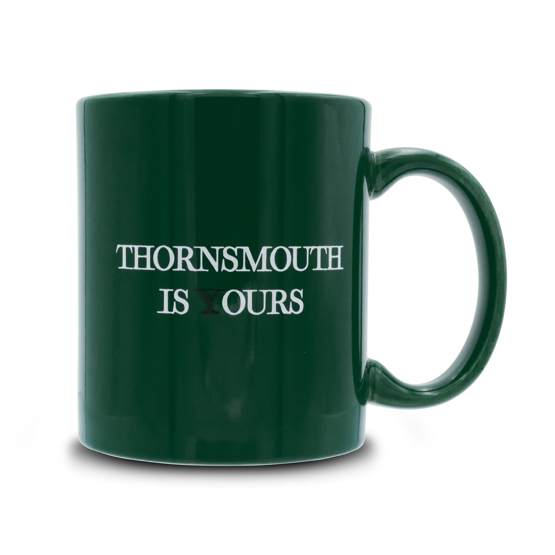 Green mug that reads thornsmouth is your's the Y is black